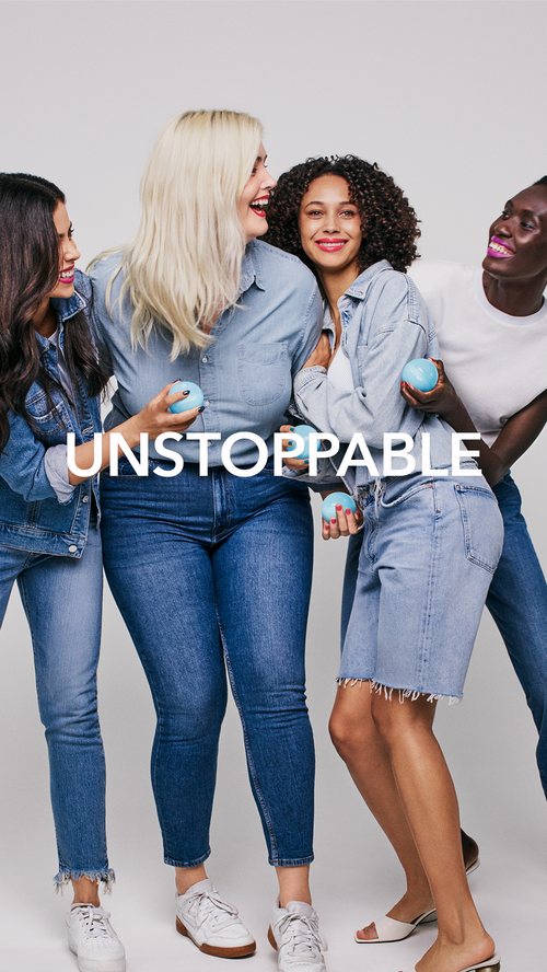Group of four women laughing together, 'Unstoppable' campaign card