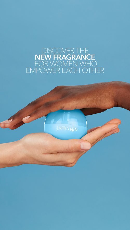 Hands presenting the Jafra We bottle, 'Discover the new fragrance' headline